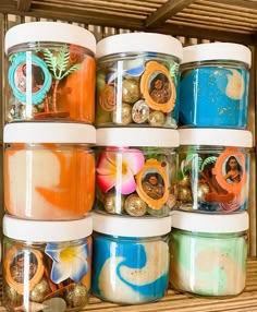 several jars filled with different types of colorful items in each one's own container