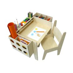 a child's desk and chair with art supplies