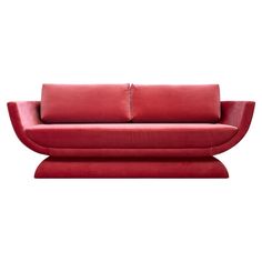 a red couch sitting on top of a white floor