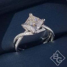 an engagement ring with a princess cut diamond