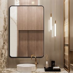 a modern bathroom with marble counter tops and wooden walls, along with an oval sink