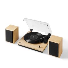 an old record player with its turntable and speakers in front of it on a white background