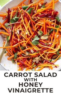 carrot salad with honey vinaigrete and almonds in a white serving bowl