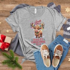 Celebrate the holidays with our Personalize  Family Christmas charming "Moo-ry Christmas 2024" Family Christmas Shirt, Group Christmas Tshirts, Baby Highland Cow shirt featuring a whimsical baby Highland cow adorned with festive Christmas lights. This design is perfect for family Christmas pajamas or holiday gatherings. The cow's joyful expression, twinkling lights, and playful snowflakes make it a delightful addition to your holiday wardrobe. Made from soft, high-quality fabric, this shirt is b Baby Highland Cow, Matching Christmas Shirts, Cow Shirt, Family Christmas Pajamas, Holiday Wardrobe, Family Christmas Shirts, Holiday Looks, Christmas Pajamas, Holiday Gathering