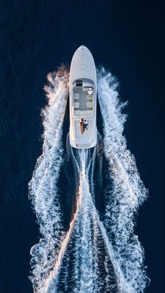 an aerial view of a motor boat in the water