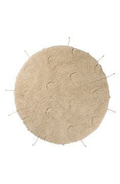 a round rug with pins sticking out of the middle and on it's side