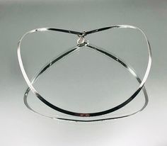 *About me: 925 silver neck ring. I'm a youngster, full of verve and ready to live around the neck of a beautiful person. I look best around a slimmer neck.  *Size: Approx. length 40.5cm / 15.94 inches, width 0.4cm, internal diameter top to bottom 13cm, side to side 12cm *Weight: Approx. 14.8 grams *Hallmark: Sheffield *Marks: 925, Lion passant (for sterling silver) *Maker: Silvarious *Age: Born 2009 almost vintage *Condition: Good almost vintage condition *Gift boxed to your door ** An almost vi Slimmer Neck, Neck Ring, Choker Necklaces, Beautiful Person, Vintage Jewellery, Collar Necklace, Sheffield, Vintage Necklace, Etsy Vintage