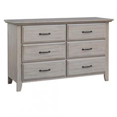 a white dresser with six drawers and two doors on the bottom drawer, in an unfinished finish