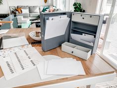 an open box on a table filled with papers