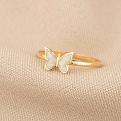 Discover the whimsical charm and luxurious craftsmanship of our 14K Gold Butterfly Ring. This enchanting piece captures the delicate beauty of butterflies, offered in a palette of blue, pink, or white enamel, and is meticulously handcrafted in your choice of gold, rose gold, or white gold. Ideal for adding a touch of nature-inspired elegance to any ensemble, it's a stunning and versatile addition to any jewelry collection. Key Features: Elegant Aesthetics: The ring features a detailed butterfly Pink Jewellery Aesthetic, Butterfly Ring Gold, Butterfly Gold Ring, Detailed Butterfly, Butterfly Jewellery, Enamel Rings, Gold Butterfly Ring, Butterfly Motif, Delicate Beauty