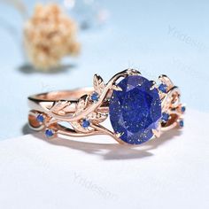 Nature Inspired Lapis Lazuli Wedding Ring Set Elegant Twig Engagement Ring Cluster Sapphire Branch Promise Ring Blue Stone Anniversary Ring ≫≫ Item Details  Make every ring to order, all rings are handmade in the United States.  Metal: Solid 10K & 14K & 18K Gold  Gold Color: Rose gold, Yellow gold, White gold ➽ Center Stone 6x8mm oval cut natural Lapis Lazuli ➽ Accent Stone:lab created blue sapphire Matching band:  lab created blue sapphire Services: Custom Order *The main stone can be other gem Gold Ring With Blue Sapphire, Lapis Ring Engagement, Lapus Lazuli Engagement Ring, Gold And Blue Ring, Dark Blue Rings, Lapis Lazuli Wedding Ring, Virgo Engagement Ring, Promise Rings Sapphire, Lapis Engagement Ring