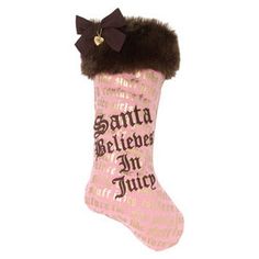 a pink christmas stocking with a black bow on the top and words written below it