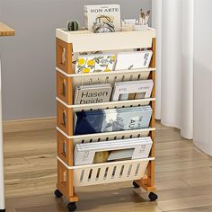 a wooden book rack with magazines on it