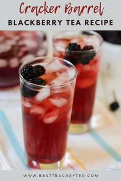 two glasses filled with blackberry tea on top of a table