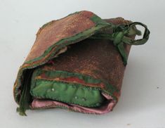 an old pouch is sitting on the table