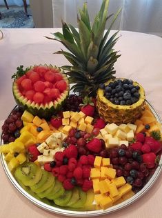 a platter filled with different types of fruit