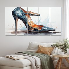 a living room scene with a couch and paintings on the wall, one high heeled shoe