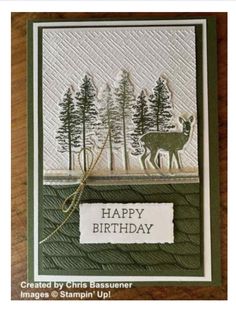 a card with a deer and trees on it