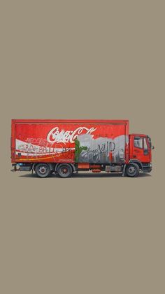 a coca - cola truck is parked on the street