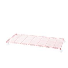 a pink shelf sitting on top of a white wall