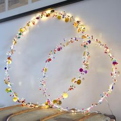 a string of lights hanging from the side of a wall