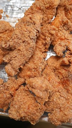 some fried food is cooling on a wire rack