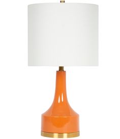 an orange table lamp with a white shade