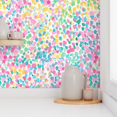 the wallpaper is colorful and has hearts on it, as well as two vases