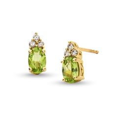 Make their August birthday a magical one with these stunning peridot and diamond stud earrings. 10K gold Each earring features a 6.0 x 4 oval-shaped spring-green peridot center stone Trios of diamonds top each center stone 1/10 ct. t.w. of diamonds Post earrings; friction backs Diamond Top, August Birthday, What A Girl Wants, Diamond Stud Earrings, Green Peridot, Diamond Stud, Spring Green, Diamond Earrings Studs, 10k Gold