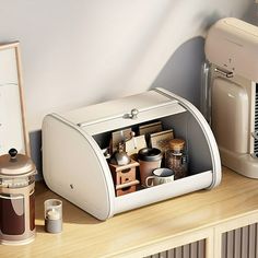 a coffee maker sitting on top of a wooden table