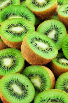 sliced kiwi fruit sitting on top of each other