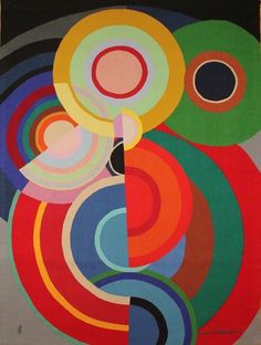 an abstract painting with multiple colors and circles in the center, on a black background