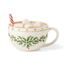 a cup filled with marshmallows and topped with a candy cane