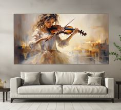 a painting of a woman playing the violin on a wall above a couch in a living room