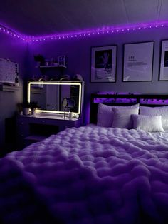 a bed with purple lights in a bedroom next to a dresser and mirror on the wall