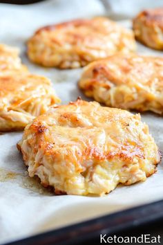 crab cakes on a baking sheet ready to go into the oven in the oven pan