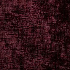 a dark red background with black spots