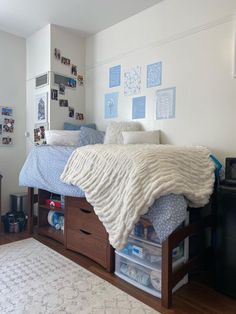 a bed with drawers underneath it in a bedroom