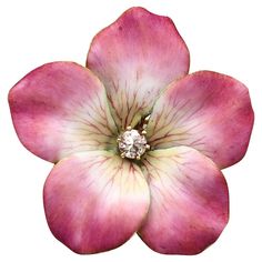 a pink flower with a diamond in it's center on a white back ground