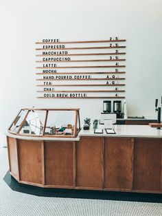 a coffee shop counter with lots of different items on it