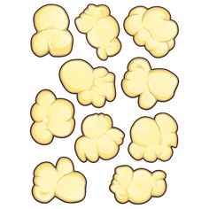 a bunch of yellow popcorn kernels on a white background