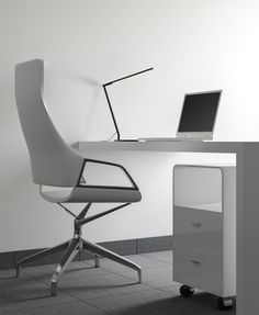 a white desk with a laptop on it and a chair in front of the desk