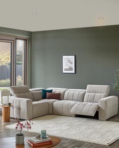 a living room with a sectional couch and coffee table