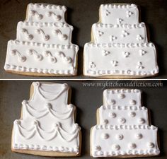 four decorated cookies sitting on top of a table