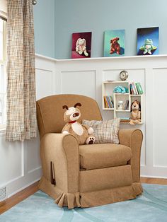 a teddy bear sitting in a chair next to a book shelf with books on it