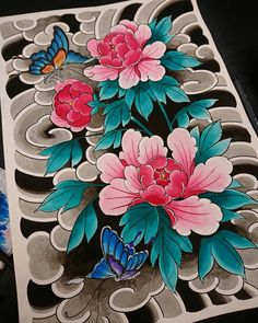 an artistically painted piece of art with flowers and butterflies on the back of it