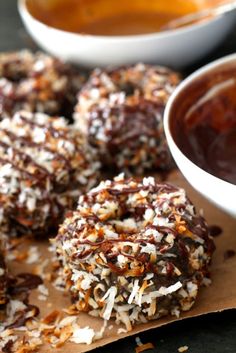 chocolate covered donuts with coconut flakes and sauce