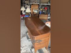 an old desk is being worked on in a shop