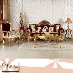 an ornate living room with gold furniture and red pillows on the couches in front of a white wall