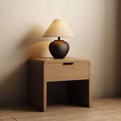 a table with a lamp sitting on top of it next to a wall and floor